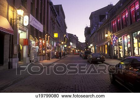 Canada, Quebec, Montreal, Shops along street at night (evening) in Vieux Montreal. View Large Photo Image Stock Image - Canada, Quebec, Montreal, Shops along street at night (evening) in Vieux Montreal.. Fotosearch
