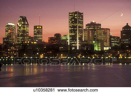 Canada, Quebec, Montreal, The illuminated skyline of downtown Montreal reflects in the waters of the St. Lawrence River (Fleuve Saint-Laurent) in the evening. View Large Photo Image Stock Image - Canada, Quebec, Montreal, The illuminated skyline of downtown Montreal reflects in the waters of the St. Lawrence River (Fleuve Saint-Laurent) in the evening. . Fotosearch