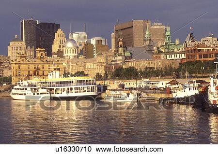 Canada, Quebec, Montreal, Vieux Port and skyline of downtown Montreal on the waters of St. Lawrence River (Fleuve Saint-Laurent). View Large Photo Image Stock Image - Canada, Quebec, Montreal, Vieux Port and skyline of downtown Montreal on the waters of St. Lawrence River (Fleuve Saint-Laurent).. Fotosearch