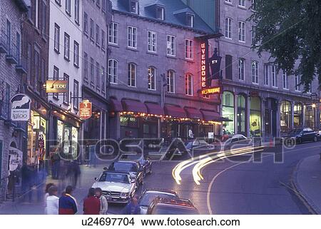 Picture -  Canada, Quebec, Quebec City, Boutiques lit up along Cote de la Montagne of the Quartier du Petit-Champlain in the evening in Old Quebec City.. Fotosearch