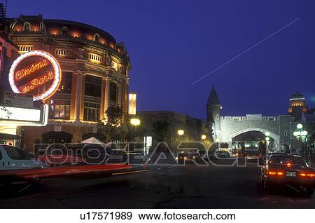 Stock Photo -  Canada, Quebec, Quebec City, Cinema de Paris at the busy Porte St. Jean in the evening.. Fotosearch