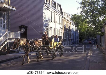 Canada, Quebec, Quebec City, Horse drawn carriage ride takes tourists through Old Quebec City. View Large Photo Image Picture - Canada, Quebec, Quebec City, Horse drawn carriage ride takes tourists through Old Quebec City.. Fotosearch