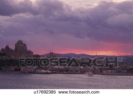 Stock Photography -  Canada, Quebec, Quebec City, Scenic view of Old Quebec City and the Chateau Frontenac from St. Lawrence River (Fleuve Saint-Laurent) at [sunrise, sunset].. Fotosearch