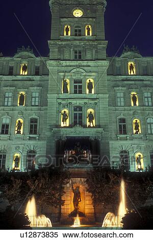Stock Photography -  Canada, Quebec, Quebec City, Statues silhouetted in the lights of The Parliament Buildings in Quebec City at night. French Renaissance architecture.. Fotosearch