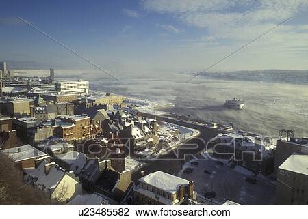 Stock Image -  Canada, Quebec, View of the St. Lawrence River (Fleuve Saint-Laurent) and Petit Champlain in winter in Quebec City., . Fotosearch