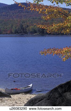 canoe, lake, Vermont, A canoe rests on the shore of Boulder Beach on Lake Groton in the fall in Groton State Forest in Caledonia County in the state of Vermont. View Large Photo Image Stock Image - canoe, lake, Vermont, A canoe rests on the shore of Boulder Beach on Lake Groton in the fall in Groton State Forest in Caledonia County in the state of Vermont. . Fotosearch