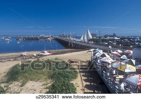 Cape Cod, outdoor cafe, Massachusetts, Provincetown, Outdoor cafe on the pier on Provincetown Harbor in Provincetown, Massachusetts. View Large Photo Image Stock Image - Cape Cod, outdoor cafe, Massachusetts, Provincetown, Outdoor cafe on the pier on Provincetown Harbor in Provincetown, Massachusetts. . Fotosearch