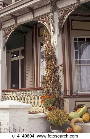 Picture -  Cape May, New Jersey, Autumn decorations on the porch steps of a house in Cape May in the state of New Jersey., . Fotosearch
