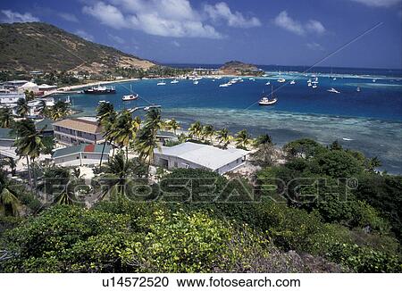 Stock Image -  Caribbean, Union Island, Grenadine Islands, Caribbean Islands, Scenic aerial view of Clifton Harbor on Union Island in the St. Vincent Grenadines (a British Commonwealth member).. Fotosearch