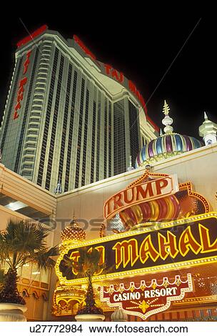 Picture -  casino, Atlantic City, Taj Mahal, New Jersey, The Taj Mahal Casino Resort illuminated at night in Atlantic City in the state of New Jersey. . Fotosearch