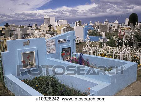 Stock Image -  cemetery, Patagonia, Chile, Pastel colored tombstones lay in a cemetery in the town of Punta Arenas in Chile.. Fotosearch