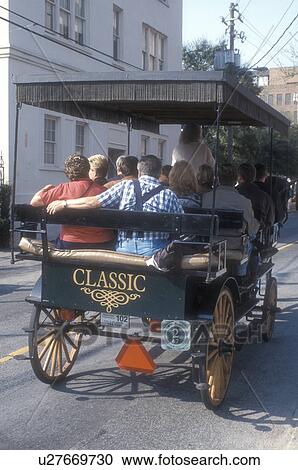 Charleston, horse-drawn carriage, South Carolina, Carriage tours of historic houses along Meeting Street in Charleston, South Carolina. View Large Photo Image Stock Image - Charleston, horse-drawn carriage, South Carolina, Carriage tours of historic houses along Meeting Street in Charleston, South Carolina. . Fotosearch