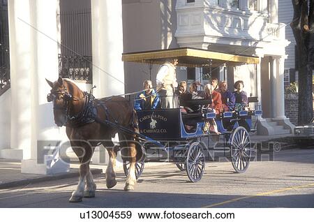 Stock Photo -  Charleston, horse-drawn carriage, South Carolina, Carriage tours of historic houses along Meeting Street in Charleston, South Carolina. . Fotosearch