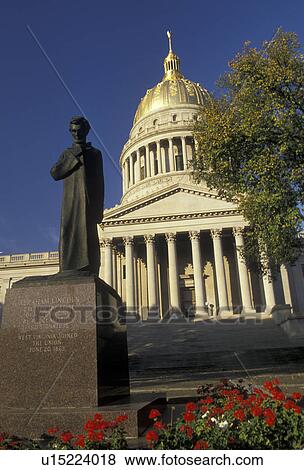 Stock Photo -  Charleston, state capitol, state house, West Virginia, The Lincoln Statue in front of The State Capitol Building in the capital city of Charleston in the autumn in the state of West Virginia. . Fotosearch