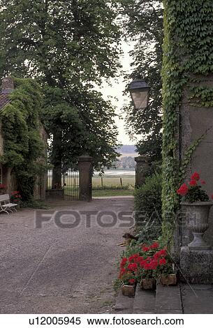 chateau, castle, Lorraine, France, Europe, Moselle, Chateau d'Alteville, Red geraniums and green ivy decorate the entrance to the castle. View Large Photo Image Stock Photography - chateau, castle, Lorraine, France, Europe, Moselle, Chateau d'Alteville, Red geraniums and green ivy decorate the entrance to the castle.. Fotosearch