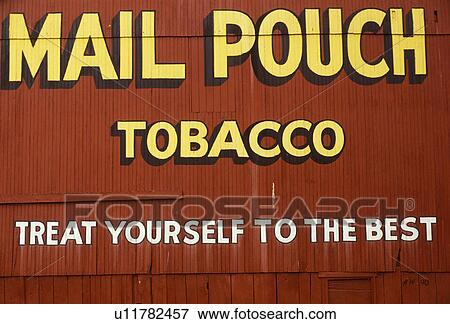 Stock Photo -  Chewing tobacco, tobacco, Mail Pouch, Ohio, Mail Pouch Tobacco advertisement (treat youself to the best) on the side of a red barn in Barkcamp State Park in Belmont in the state of Ohio.. Fotosearch