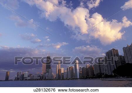 Chicago, Illinois, A view of the skyline of downtown Chicago from the waters of Lake Michigan at sunset View Large Photo Image Stock Photograph - Chicago, Illinois, A view of the skyline of downtown Chicago from the waters of Lake Michigan at sunset . Fotosearch