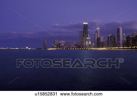 Chicago, Illinois, The illuminated skyline of downtown Chicago from the waters of Lake Michigan at night  View Large Photo Image Stock Image -  Chicago, Illinois, The illuminated skyline of downtown Chicago from the waters of Lake Michigan at night . Fotosearch