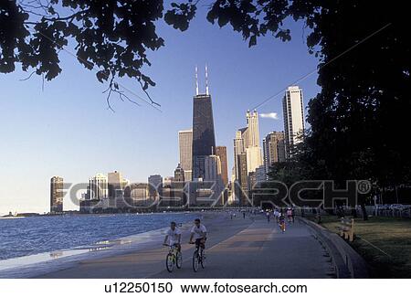 Stock Image -  Chicago, skyline, Illinois, Skyline of downtown Chicago from the recreation path at Lincoln Park on Lake Michigan in the state of Illinois.. Fotosearch