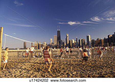 Chicago, volleyball, skyline, Illinois, People playing volleyball games on the beach along Lake Michigan at North Avenue Park with skyline of downtown Chicago in the background in the state of Illinois. View Large Photo Image Stock Image - Chicago, volleyball, skyline, Illinois, People playing volleyball games on the beach along Lake Michigan at North Avenue Park with skyline of downtown Chicago in the background in the state of Illinois. . Fotosearch