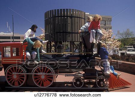 children, Playground, Georgia, Marietta, Children playing on the miniature replica of the General steam engine in Marietta Square. View Large Photo Image Stock Photo -  children, Playground, Georgia, Marietta, Children playing on the miniature replica of the General steam engine in Marietta Square.. Fotosearch