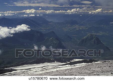Chile, Andes, Mt. Villarica, Scenic view of Andes mountains and clouds from the icy slopes of the active Villarica Volcano the South-Central Region (Land of Lakes and Volcanoes) in Chile. View Large Photo Image Stock Image - Chile, Andes, Mt. Villarica, Scenic view of Andes mountains and clouds from the icy slopes of the active Villarica Volcano the South-Central Region (Land of Lakes and Volcanoes) in Chile. . Fotosearch