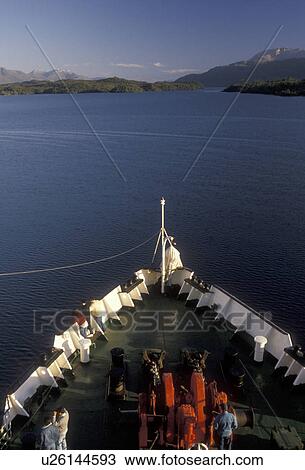 Chile, Pacific Ocean, Patagonia, A passenger/cargo ferry boat cruises through beautiful scenery of fjords and icebergs going from southern Chile to Puerto Montt. View Large Photo Image Stock Image - Chile, Pacific Ocean, Patagonia, A passenger/cargo ferry boat cruises through beautiful scenery of fjords and icebergs going from southern Chile to Puerto Montt. . Fotosearch