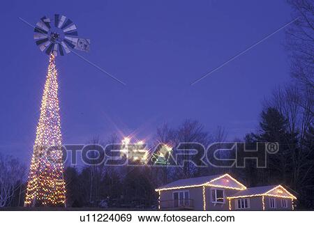 Christmas, display, Vermont, House and windmill decorated with Christmas lights for the holiday season at night in Washington County in the state of Vermont. An illuminated Reindeer pulling sleigh with Santa Claus travels from the house to the windmill. View Large Photo Image Stock Photo - Christmas, display, Vermont, House and windmill decorated with Christmas lights for the holiday season at night in Washington County in the state of Vermont. An illuminated Reindeer pulling sleigh with Santa Claus travels from the house to the windmill.. Fotosearch