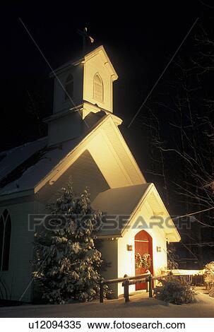 Stock Photography -  church, Christmas, winter, Vermont, Cavalry Episcopal Church in Underhill with Christmas decorations in the snow at night in Chittenden County in the state of Vermont. . Fotosearch