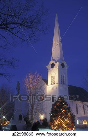 Stock Image -  church, Vermont, winter, First Congregational Church decorated for the Christmas holiday season at night in the winter in Manchester Village in Bennington County in the state of Vermont.. Fotosearch