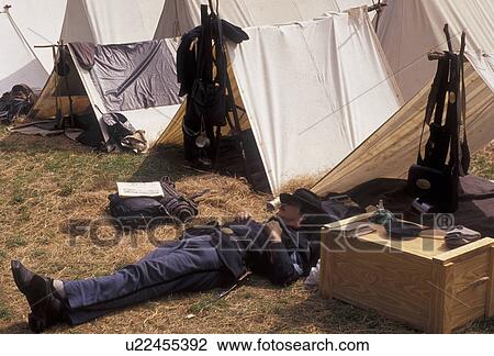 Civil War Reenactment, confederate, Stone Mountain, Atlanta, Georgia's Stone Mountain Park, Georgia, A man dressed as a Union Officer takes a break by his tent during the Civil War Reenactment at the Antebellum Jubilee at Stone Mountain Park in Atlanta i View Large Photo Image Stock Image - Civil War Reenactment, confederate, Stone Mountain, Atlanta, Georgia's Stone Mountain Park, Georgia, A man dressed as a Union Officer takes a break by his tent during the Civil War Reenactment at the Antebellum Jubilee at Stone Mountain Park in Atlanta i. Fotosearch