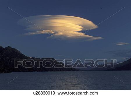 cloud, lenticular, Patagonia, Chile, Torres Del Paine National Park, Andes, A lenticular cloud hovers above Lago (lake) Grey in the early evening in Parque Nacional Torres Del Paine (National Park) in Chile. View Large Photo Image Stock Photo - cloud, lenticular, Patagonia, Chile, Torres Del Paine National Park, Andes, A lenticular cloud hovers above Lago (lake) Grey in the early evening in Parque Nacional Torres Del Paine (National Park) in Chile.. Fotosearch