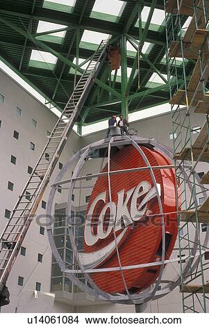 Picture -  coca-cola, coke, World of Coca-Cola, Atlanta, Georgia, Installation of the red coke sign at the World of Coca-Cola in Underground Atlanta.. Fotosearch