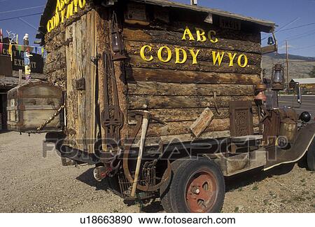 Cody, Wyoming, An old pick up truck with a wooden sided house on its flatbed is parked in front of an old trading post in Cody in the state of Wyoming., View Large Photo Image Stock Image - Cody, Wyoming, An old pick up truck with a wooden sided house on its flatbed is parked in front of an old trading post in Cody in the state of Wyoming., . Fotosearch