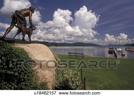 Cooperstown, lake, New York, Statue of a boy and his dog overlooking Otsego Lake in Cooperstown in the state of New York. View Large Photo Image Stock Photo - Cooperstown, lake, New York, Statue of a boy and his dog overlooking Otsego Lake in Cooperstown in the state of New York.. Fotosearch