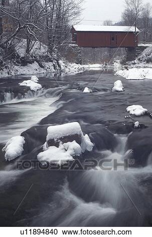 covered bridge, Vermont, winter scene, Slaughter House Covered Bridge crosses the swiftly moving Dog River in the winter in Northfield Falls in Washington County in the state of Vermont. View Large Photo Image Stock Image - covered bridge, Vermont, winter scene, Slaughter House Covered Bridge crosses the swiftly moving Dog River in the winter in Northfield Falls in Washington County in the state of Vermont. . Fotosearch