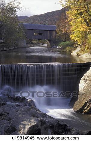 covered bridge, waterfall, fall, Vermont, The Warren Covered Bridge c. 1880 crosses over the Mad River as it cascades over the waterfall in Warren in Washington County in the state of Vermont during the autumn season. View Large Photo Image Stock Photography - covered bridge, waterfall, fall, Vermont, The Warren Covered Bridge c. 1880 crosses over the Mad River as it cascades over the waterfall in Warren in Washington County in the state of Vermont during the autumn season.. Fotosearch