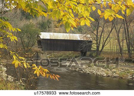 covered bridge, wooden bridge, fall, Vermont, The Moxley or Guy Covered Bridge c. 1883 in Chelsea is framed by yellow leaves during autumn in Orange County in the state of Vermont. View Large Photo Image Stock Image - covered bridge, wooden bridge, fall, Vermont, The Moxley or Guy Covered Bridge c. 1883 in Chelsea is framed by yellow leaves during autumn in Orange County in the state of Vermont.. Fotosearch