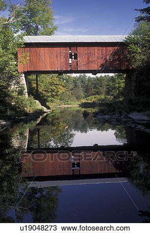 covered bridge, wooden bridge, Vermont, The red wooden Slaughter House Covered Bridge reflects in the calm waters of the Dog River in Northfield Falls in Washington County in the state of Vermont. View Large Photo Image Stock Image - covered bridge, wooden bridge, Vermont, The red wooden Slaughter House Covered Bridge reflects in the calm waters of the Dog River in Northfield Falls in Washington County in the state of Vermont.. Fotosearch