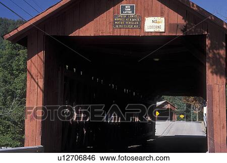 Stock Photograph -  covered bridge, wooden bridge, Vermont, The Newell Covered Bridge can be seen from inside the Station Covered Bridge c. 1872 in Northfield Falls in Washington County in the state of Vermont in early autumn. The only place in New England where two covered . Fotosearch