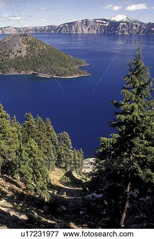Stock Photo -  Crater Lake, Crater Lake National Park, Cascade Range, Cascade Mountains, Oregon, Scenic view of the deep blue waters of Crater Lake and Wizard Island in Crater Lake Nat'l Park in the state of Oregon.. Fotosearch