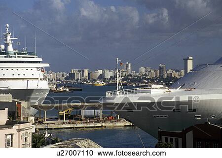 cruise ship, Puerto Rico, San Juan, Caribbean, Porto Rico, Caribbean Islands, Cruise ships docked in the harbor of San Juan in Puerto Rico. Skyline of the city in the distance. View Large Photo Image Stock Image - cruise ship, Puerto Rico, San Juan, Caribbean, Porto Rico, Caribbean Islands, Cruise ships docked in the harbor of San Juan in Puerto Rico. Skyline of the city in the distance.. Fotosearch