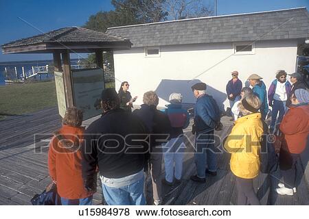 Stock Photo -  Cumberland Island, visitors center, St. Marys, Georgia, A group of people listen to a Ranger Talk at the visitors center for Cumberland Island National Seashore in St. Marys, Georgia.. Fotosearch