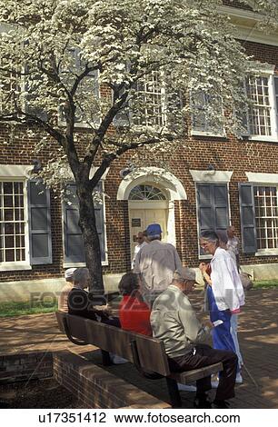 Stock Image -  Dahlonega, Georgia, gold rush, Visitors sit outside the Dahlonega Gold Museum State Historic Site in the spring in Dahlonega in the state of Georgia.. Fotosearch
