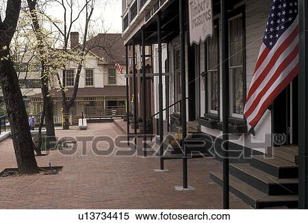 Dahlonega, Georgia, gold rush, The U. S. flag flies in front of shops in downtown Dahlonega in the state of Georgia. View Large Photo Image Stock Photography - Dahlonega, Georgia, gold rush, The U. S. flag flies in front of shops in downtown Dahlonega in the state of Georgia.. Fotosearch