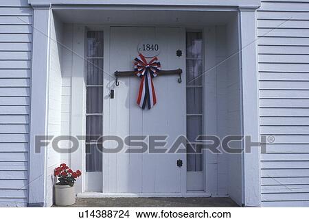 decoration, door, patriotic, Vermont, VT, Red, white, and blue bow on a door of an historic house celebrating Independence Day in Tunbridge. View Large Photo Image Picture - decoration, door, patriotic, Vermont, VT, Red, white, and blue bow on a door of an historic house celebrating Independence Day in Tunbridge. . Fotosearch