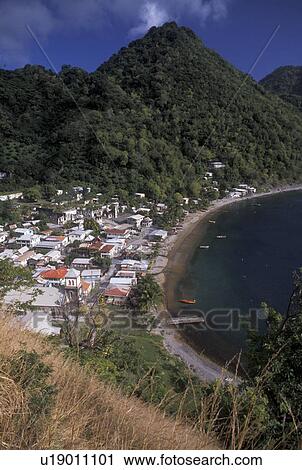 Dominica, Caribbean, Caribbean Islands, Aerial view of beachfront houses and and scenic hillsides in Soufriere on the island of Dominica. View Large Photo Image Stock Image -  Dominica, Caribbean, Caribbean Islands, Aerial view of beachfront houses and and scenic hillsides in Soufriere on the island of Dominica.. Fotosearch