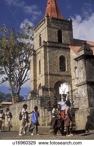 Dominica, Caribbean, Caribbean Islands, cathedral, School children walking home from school in front of cathedral in Portsmouth on the island of Dominica. View Large Photo Image Stock Photo - Dominica, Caribbean, Caribbean Islands, cathedral, School children walking home from school in front of cathedral in Portsmouth on the island of Dominica.. Fotosearch