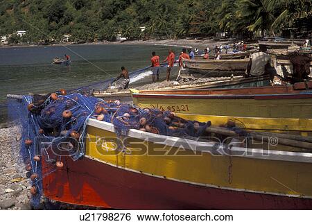 Dominica, Caribbean, Caribbean Islands, Fishing nets in boat and local fishermen working with nets on the beach at Scotts Head on the island of Dominica. View Large Photo Image Stock Photograph - Dominica, Caribbean, Caribbean Islands, Fishing nets in boat and local fishermen working with nets on the beach at Scotts Head on the island of Dominica.. Fotosearch