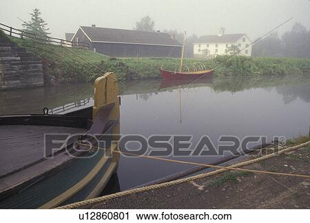 Erie Canal, Erie Canal Village, Rome, New York, Canal boats on the quiet calm water at the Erie Canal Village an 1840 community along the Erie Canal in Rome in the state of New York. View Large Photo Image Stock Image - Erie Canal, Erie Canal Village, Rome, New York, Canal boats on the quiet calm water at the Erie Canal Village an 1840 community along the Erie Canal in Rome in the state of New York.. Fotosearch